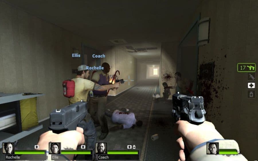 Left 4 Dead 2: Dual pistols and three teammates fill a hotel corridor, with the squad health bars visible.