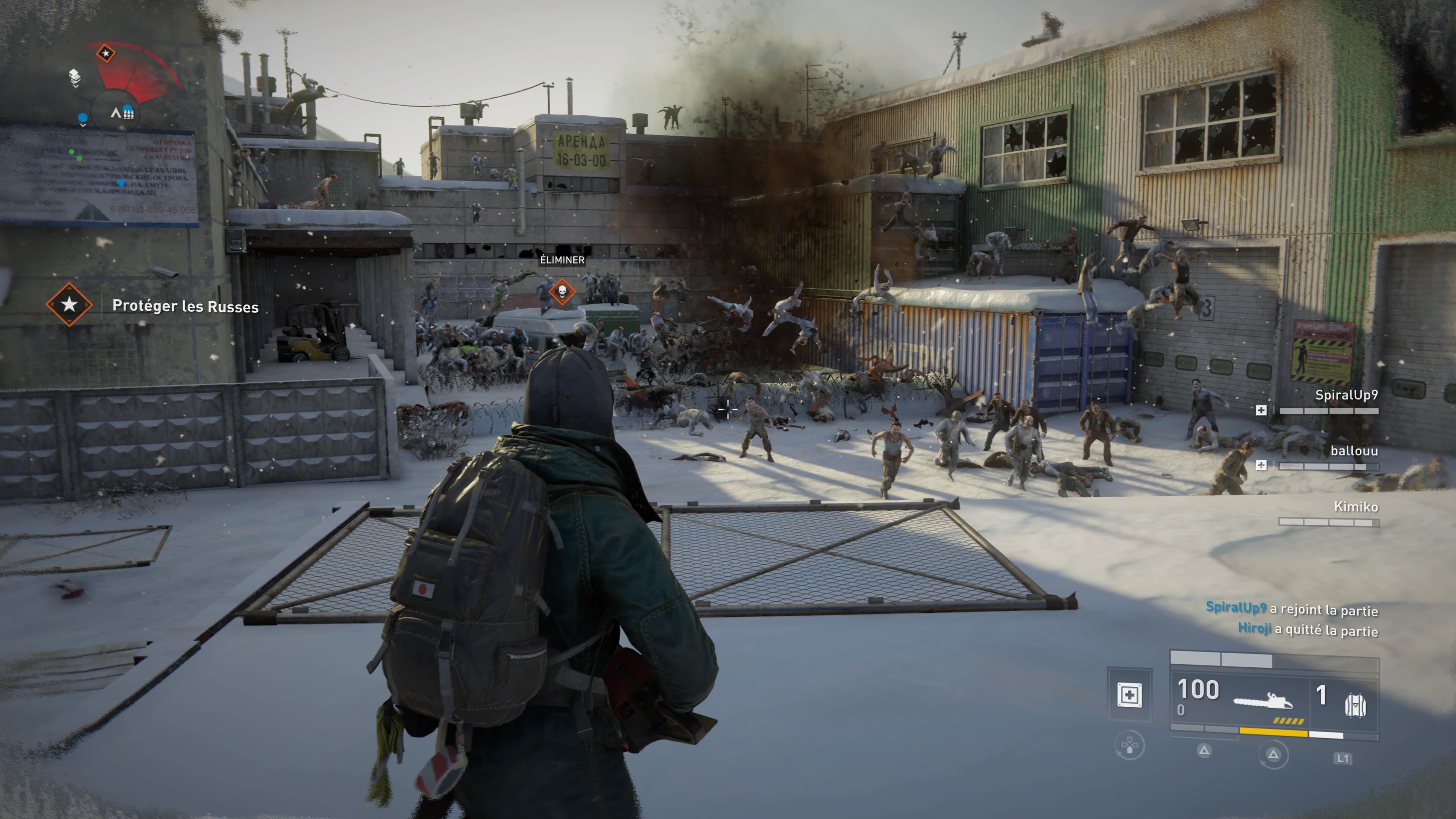 World War Z: Aftermath: A survivor faces a zombie swarm in a snowy industrial yard, with objectives and squad status visible.